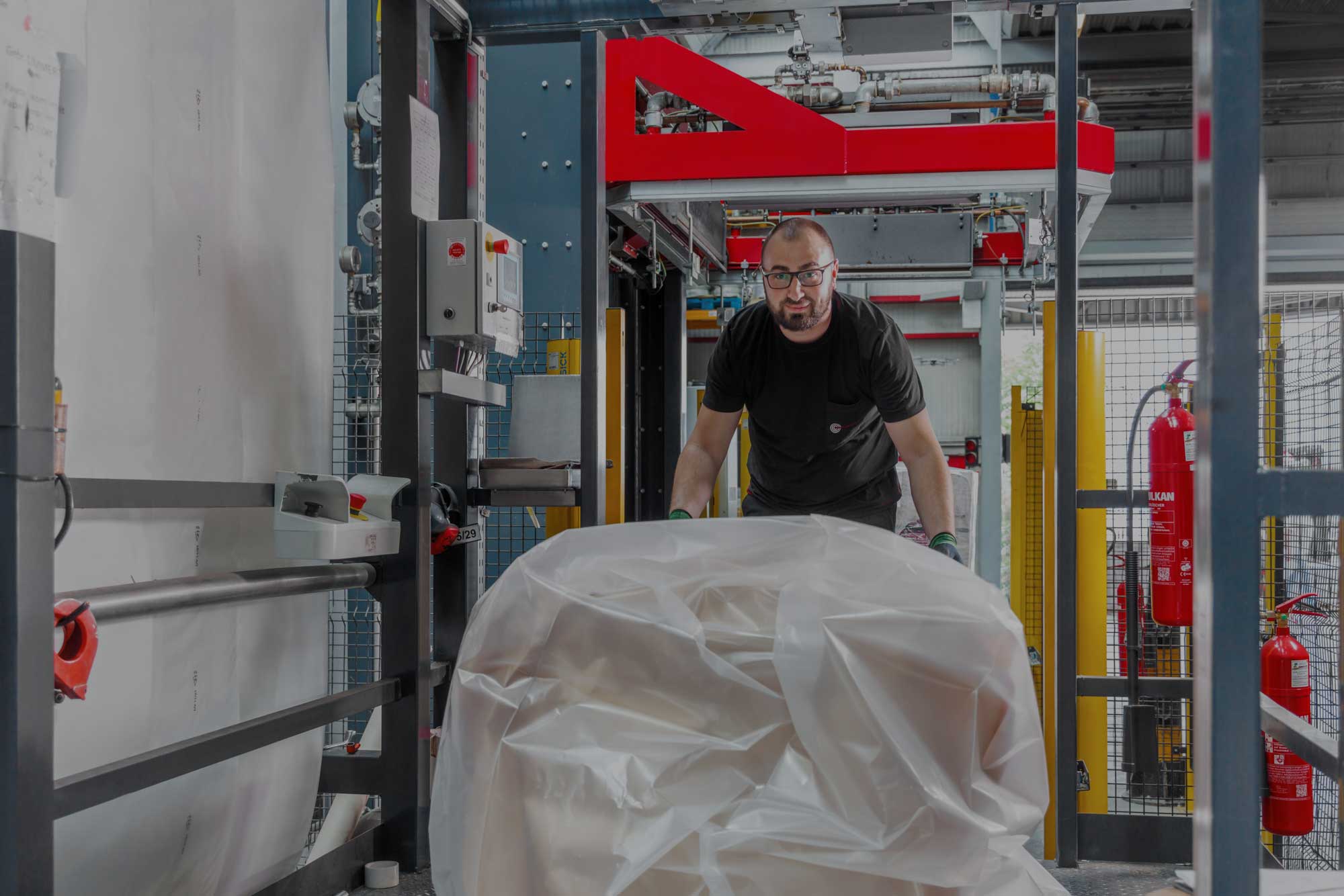  Employee transports a cable drum